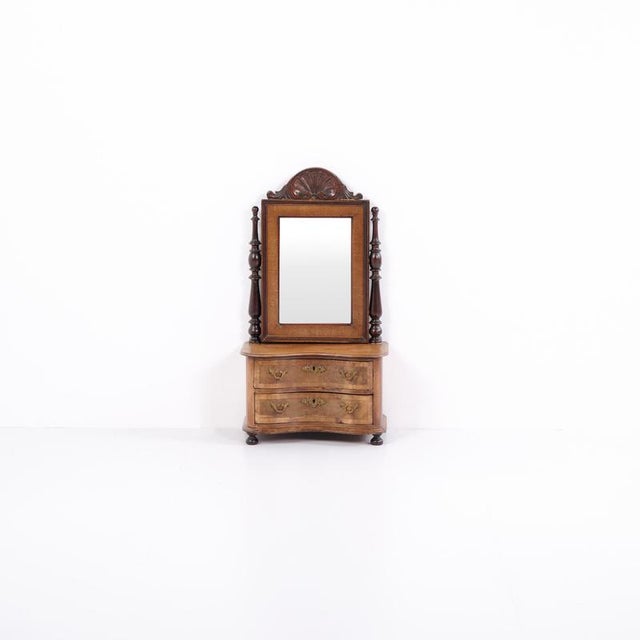 Small piece of children’s furniture from around 1860, made in mahogany with mirror and two drawers. A decorative and rare...