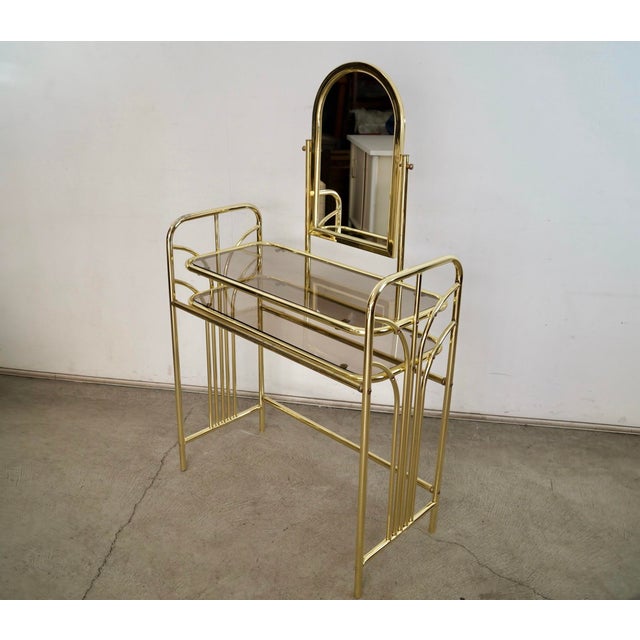 Vintage 1970's Art Deco vanity for sale. It was manufactured by Rosalco, and was part of the Commodore Collection. It's in...