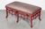 A striking vintage faux bamboo pagoda bench featuring an elaborate red lacquered frame with turned spindle fretwork,...