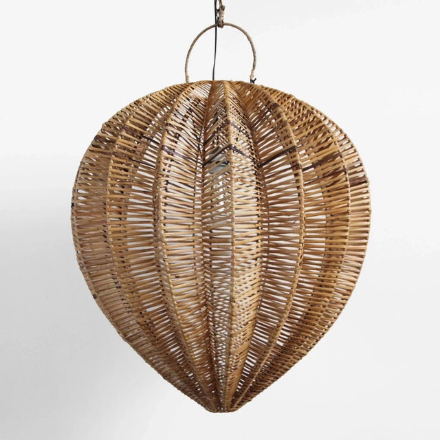 Honey stained rattan starfruit medium lantern. Beautiful natural material and organic shape. Each lantern may have slight...