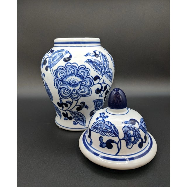 Add timeless elegance to your home with this stunning Chinoiserie-style blue and white ceramic ginger jar. Standing at...