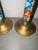 A striking pair of vintage late-20th-century Chinese brass and cloisonné enamel candlestick holders. This matching set...