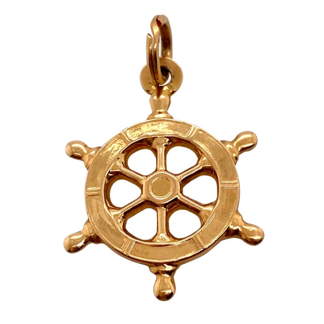 This is part of Chairish’s Fine Jewelry assortment. A fun charm or pendant in 14K gold in the form of a ship wheel....