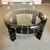 A fantastic circular postmodern coffee table. The base is constructed of square dark wood blocks, with silver joints. The...