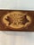 Charming vintage walnut wood music box featuring a hand-carved Edelweiss flower on hinged lid in walnut and maple wood....