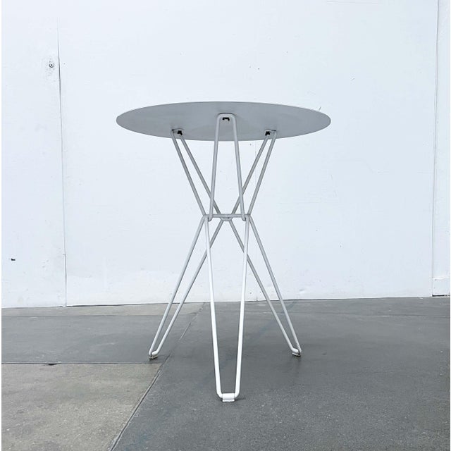 Minimalist metal table from the Tio series by Finnish manufacturer Massproductions, designed by Chris Martin. The design...