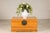 This vintage Chinese pine trunk combines clean lines, warm honey-toned wood, and understated brass hardware in a form that...