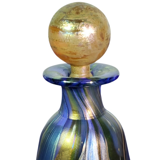 Elegant set of four Isle of Wight art glass pieces. Handcrafted, they are distinguished by their vibrant colors, golden...