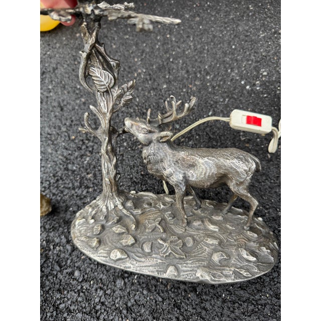Spanish silverplate stag lamp with original wood candle cover. Newly rewired. 9”l x 5”d x 14”h. Height to bottom of socket...