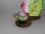A fine pair of Chinese Canton painted enamel peach-form cups and saucers, Qing dynasty, likely 19th century, each worked...