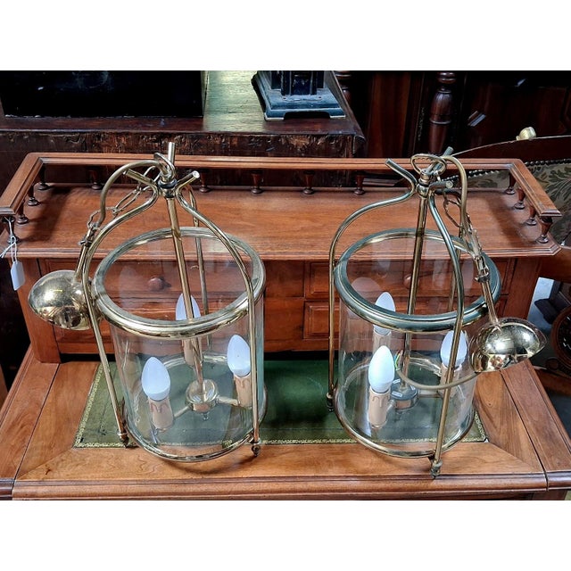 Hanging Lanterns in Polished Brass and Cylindrical Glass, 1950s, Set of 2, in Good conditions. Designed 1950 to 1959 Up to...