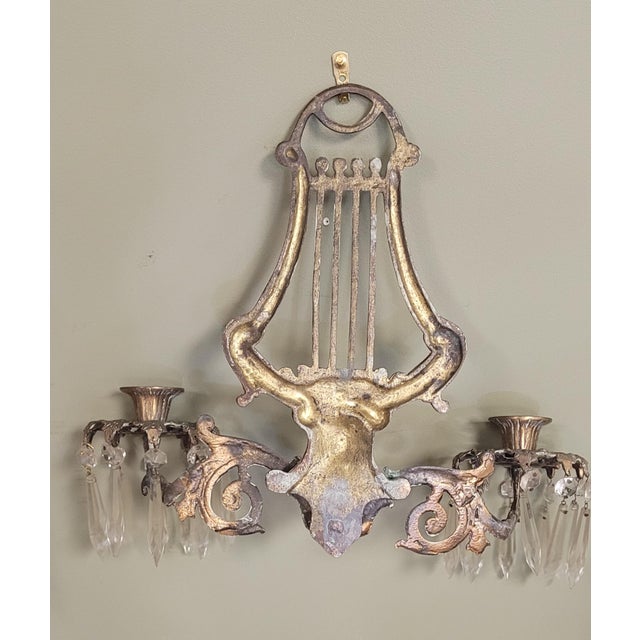 A fine pair of 1930s solid brass swan and harp crystal wall sconces. Non-electrified featuring 20 Crystal prisms on each...