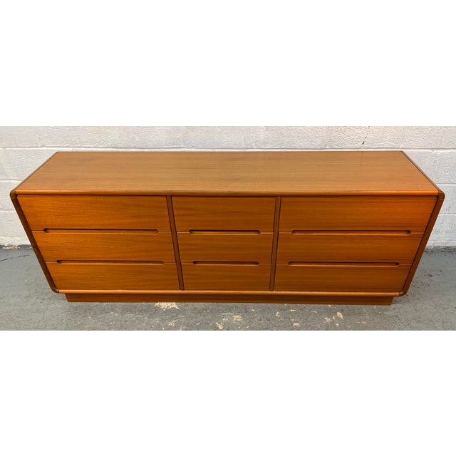 Beautiful vintage Danish Modern teak 9-drawer lowboy dresser / credenza, manufactured by Sun Cabinet Co. This exceptional...