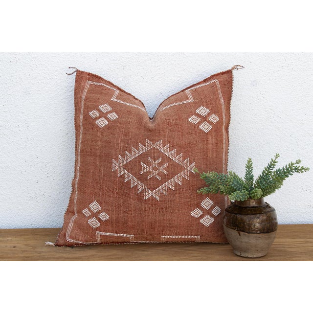Woven from the resilient fibers of the Saharan aloe vera cactus — often called cactus silk or Sabra silk — this large...
