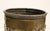 Mid-19th century circular brass jardiniere, French. Roped collar. The repousse motifs are of cherub artists at work in...