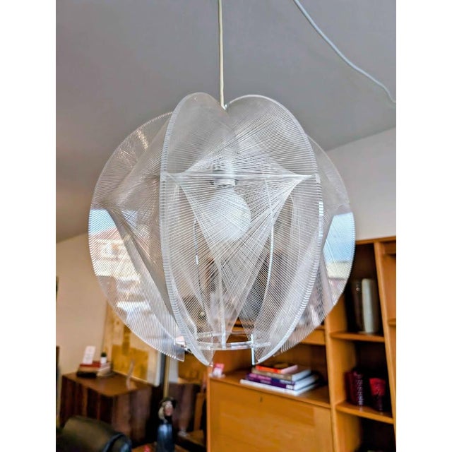 Excellent mid century modern pendant lamp designed by Paul Secon in the early 1960s. He used nylon filament in his...