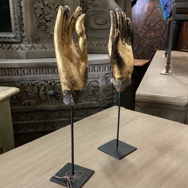 This pair of exquisite hand-carved hands are from Mandala, Burma. This pair of hands from the 19th Century have a layer of...
