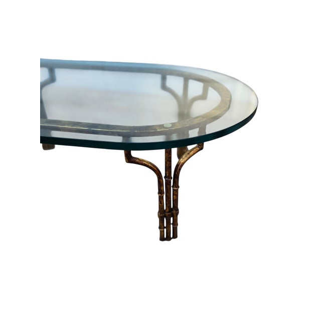 Beautiful Vintage faux bamboo coffee table in excellent condition. Minor ware. The glass top is clear. Please note you can...