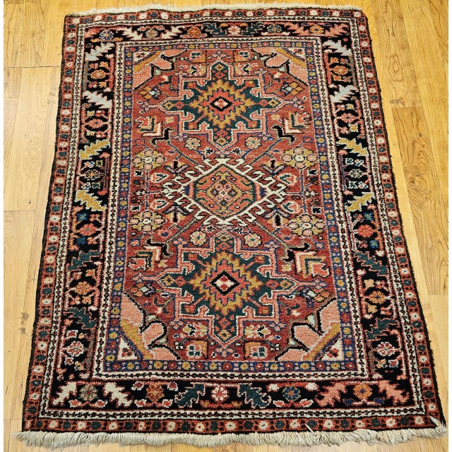 "This traditional Persian Heriz Karajeh rug from Northwest Persia features the iconic three-medallion layout...
