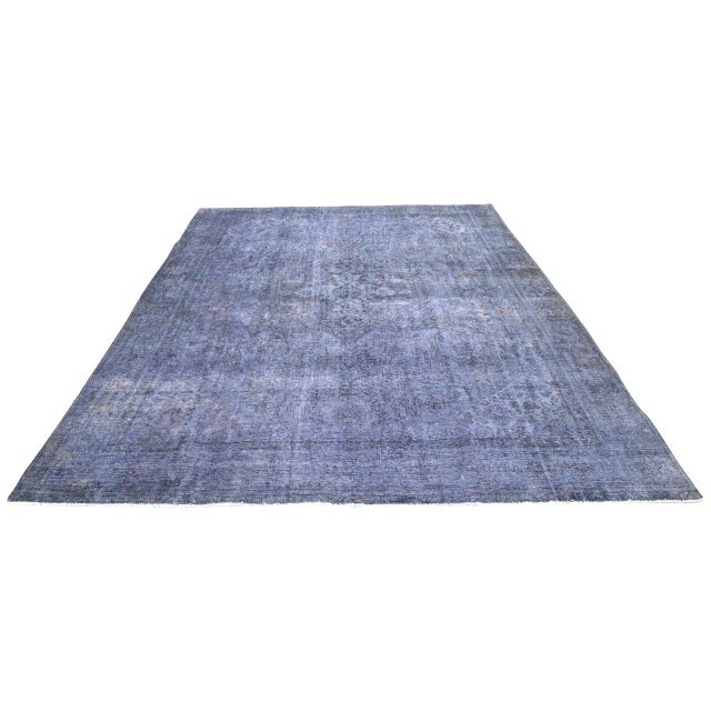 Hand-knotted with care using traditional rug-making techniques, this wool rug blends timeless craftsmanship with a modern...