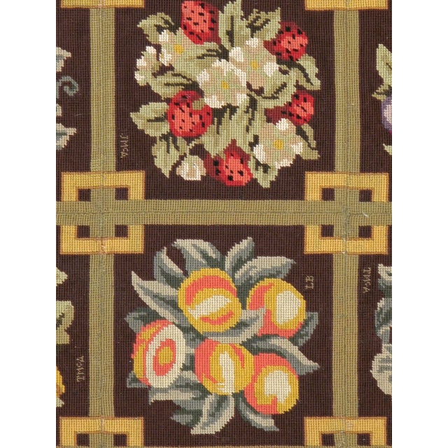 A vintage English needlepoint carpet from the mid-20th century.