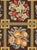 A vintage English needlepoint carpet from the mid-20th century.