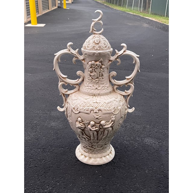 Bring old-world European craftsmanship into your home with this impressive 28 inch Portuguese ceramic lidded urn....