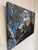 This oil painting depicts a trio of owls nestled in the branches of a tree, their expressive eyes drawing the viewer in...