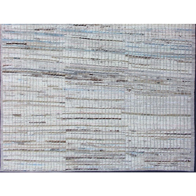 Measures: 8'8 x 11'7. Moroccan Tribal Rug in Ivory and Soft Blue by Keivan Woven Arts 8'8 x 11'7 Moroccan Tribal Rug with...