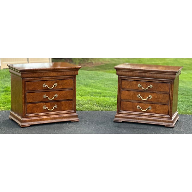 Presenting a magnificent, heirloom-quality, owned by one family, pair of late 20th-century bedside chests/nightstands from...
