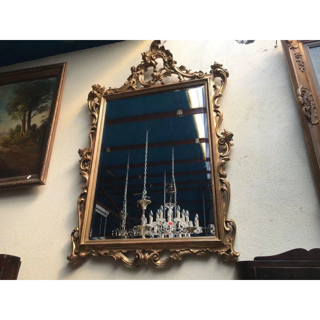 A mirror in a baroque frame Covered with gold paint, they are in good or even very good condition, although there are...