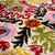 "Evoke the mystery of a desert night with this masterfully hand-knotted silk velvet ikat pillow. Measuring 16x16 inches...