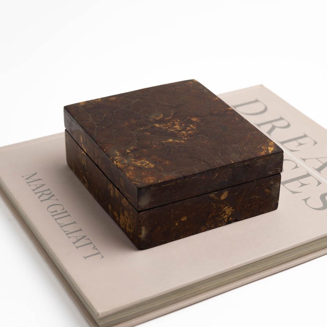 Vintage rectangular lidded box crafted from tessellated coconut shell in warm brown tones, with a rich mosaic-like...