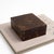 Vintage rectangular lidded box crafted from tessellated coconut shell in warm brown tones, with a rich mosaic-like...