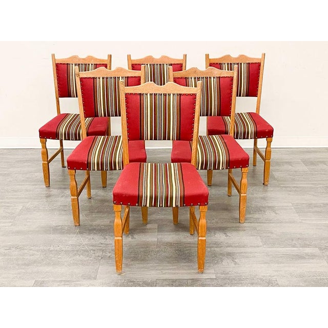 A good set of 6 Danish modern (circa 1960's) dining chairs. The chairs are of figured / carved oak and are upholstered in...
