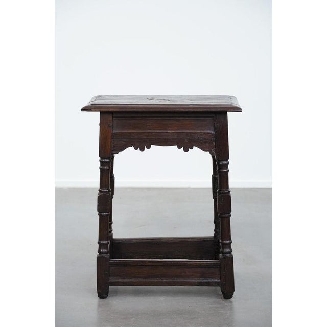 We are offering this functional, charming, and antique 18th-century English oak joint stool/side table/stool with a...