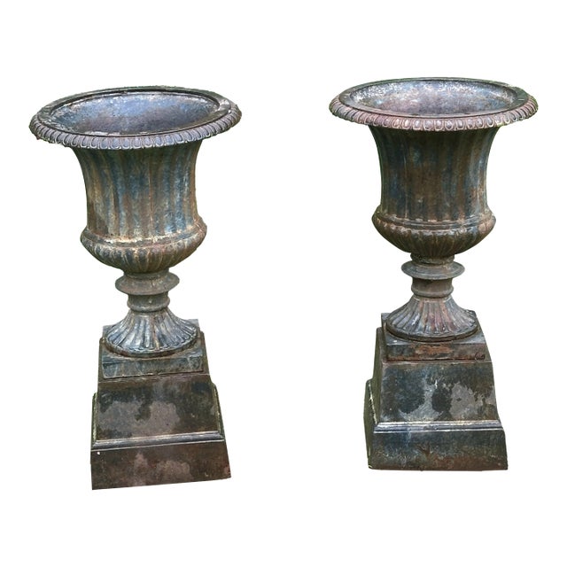 Late 20th Century Neoclassical Cast Iron Urns on Plinths - A Pair For Sale