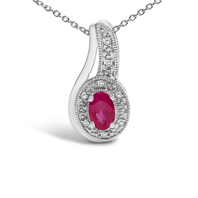 Embrace timeless elegance with this exquisite pendant necklace, where the allure of a natural, heat-treated red ruby meets...