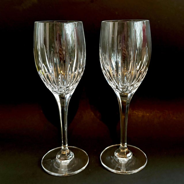 Elegant vintage Mikasa Arctic Lights wine glasses featuring sleek vertical cuts and tall, graceful stems. Their classic...