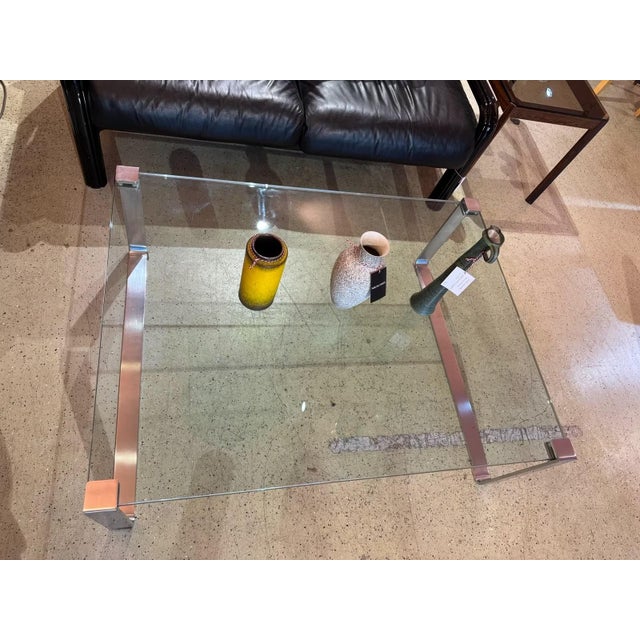 Classic glass table by Ronald Schmitt, model K831. Very heavy, thick glass top (1.9 mm thick) with the typical steel legs....