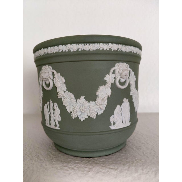 1960s Celadon Sage Green Wedgwood Jasperware cache pot planter features lion's head design with grapevine swag and...