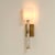 Timeless materials, contemporary lines, and a warm modern metallic finish are expertly combined in this striking sconce....