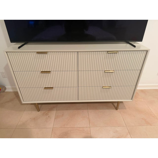 West Elm Quinn 6-Drawer Dresser (56") in Haze with Antique Brass hardware. Beautiful fluted front design with six spacious...