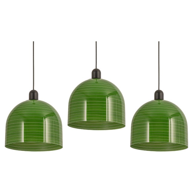 Green glass pendant lights by peill & putzler, manufactured in germany, circa the 1970s. Wonderful light effect .high...