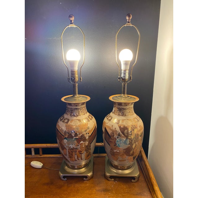 A lovely pair of Japanese Moriage Satsuma porcelain table lamps from Taiwan. Featuring a gorgeous color palette of bronze,...