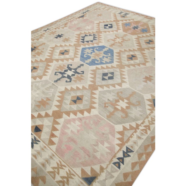 This exquisite Turkish flatweave kilim rug is a stunning masterpiece of traditional craftsmanship. Each rug is...