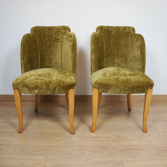 A pair of art deco 'cloud' chairs by harry & lou epstein. Birdseye maple veneered with moss green fabric re-upholstery....