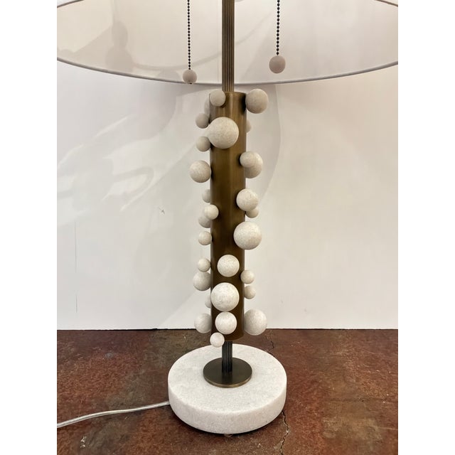 Stylish Revelation Atom Lamps - Pair. White Drum shade, gold body, round white accent spheres, white marble base. Original...