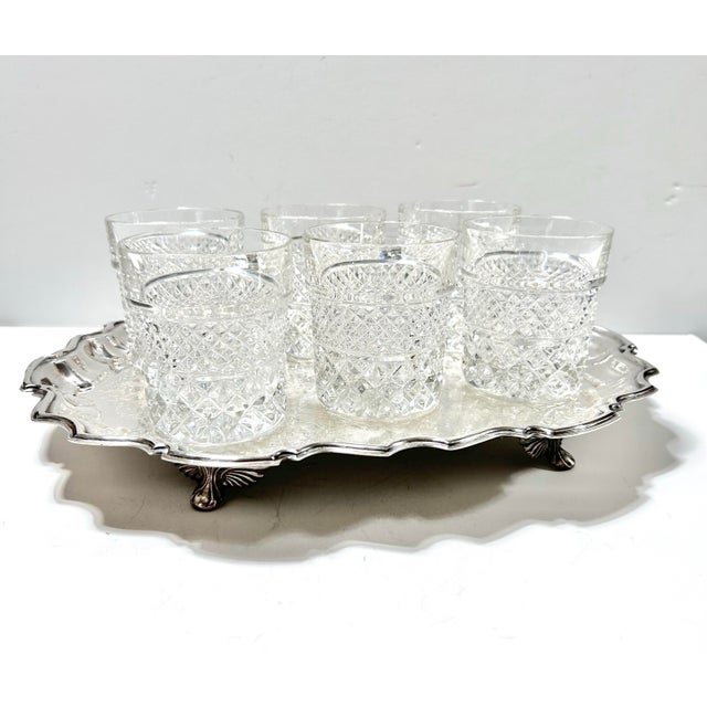 An elegant antique Raimond silverplate gallery tray featuring a scalloped rim, engraved surface, and classic early 20th-...