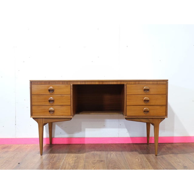 Elevate your home aesthetics with the Mid Century Modern Vintage Teak Vanity Desk by Butilux, available at Mid Century...